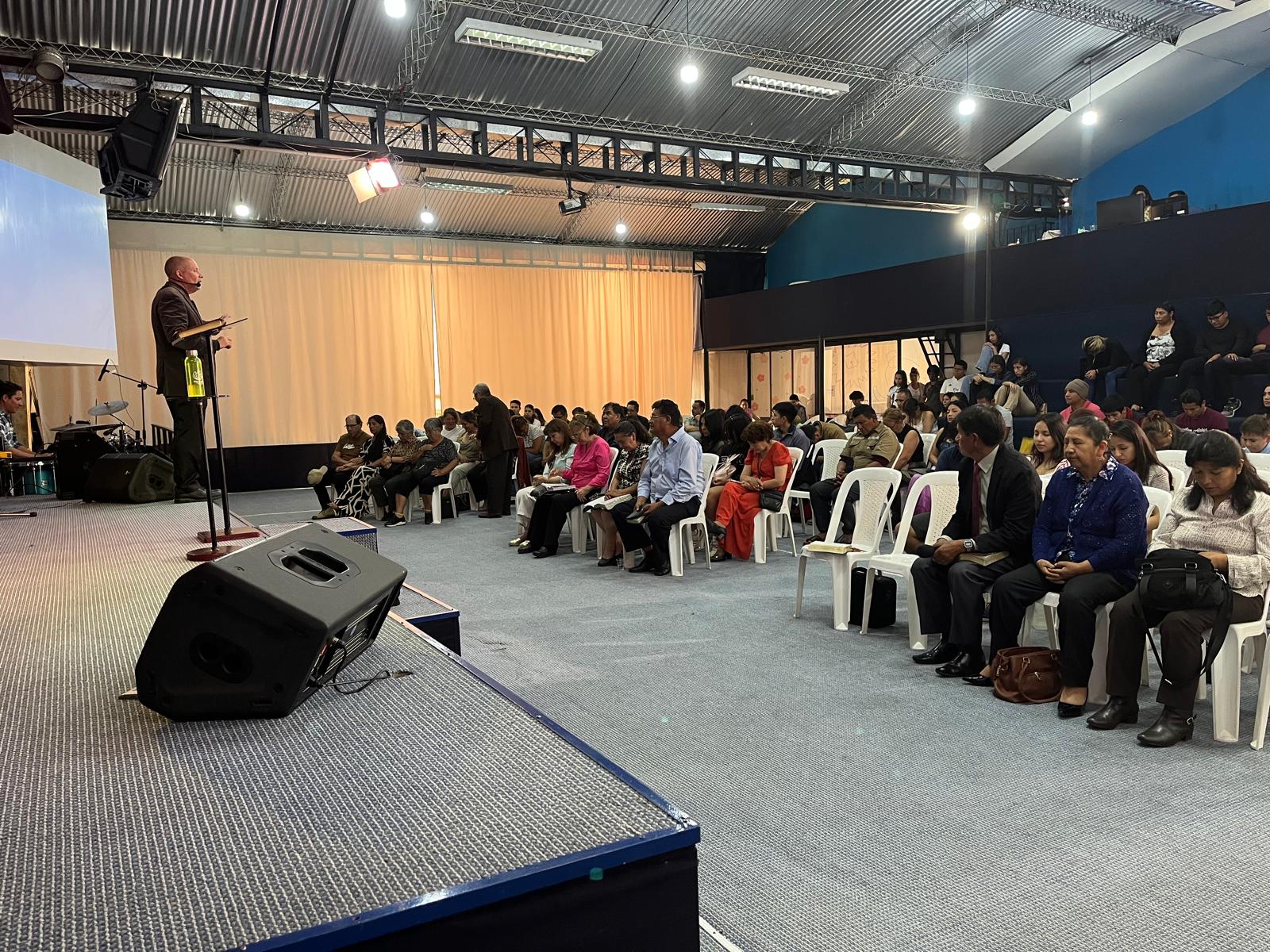 Bolivian congregation listening attentively during service