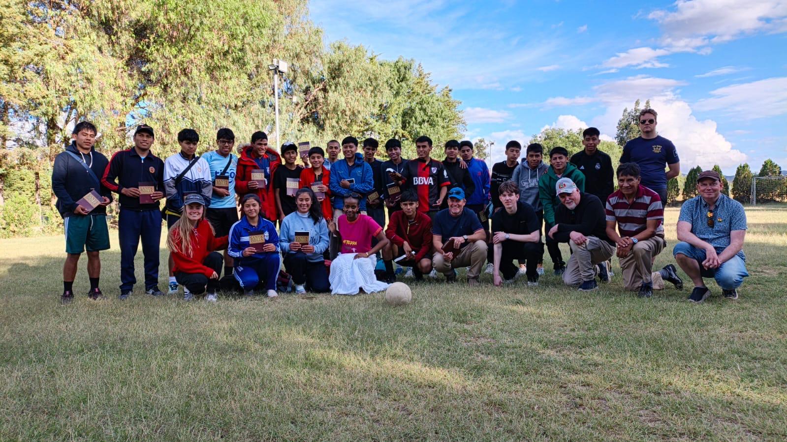 Soccer team holding Bibles after evangelism in Bolivia